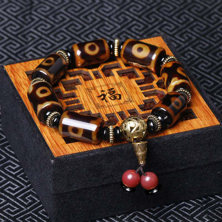 Buddha Stones Tibetan Nine-Eye Dzi Bead Fortune Charm Bracelet - Nine-Eye Dzi Bead(Wrist Circumference: 7.1-7.5 in / 18-19 cm) - image 0