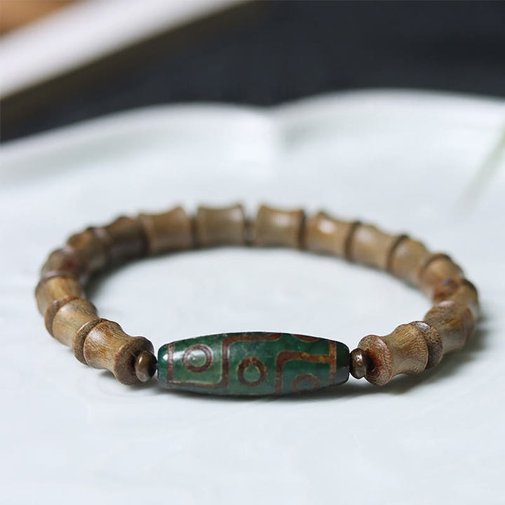 Buddha Stones Tibetan Nine-Eye Dzi Bead Green Sandalwood Peace Bracelet