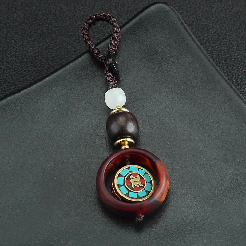 Buddha Stones Ebony Wood Sanskrit Four-leaf Clover Buddha's Eye Peace Rotatable Key Chain - image 2