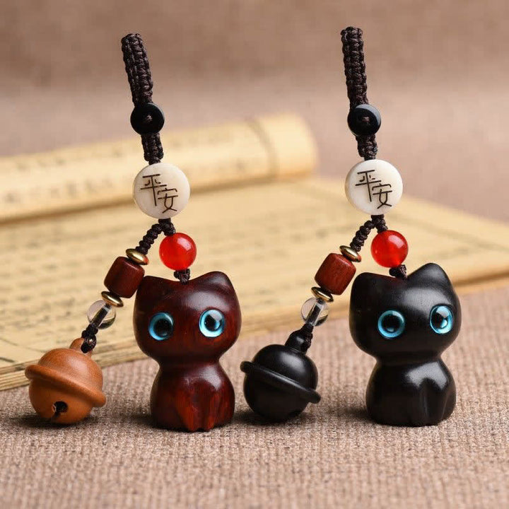 Buddha Stones Ebony Wood & Red Sandalwood Hand Carved Cat Bell Protection Keychains - image 0