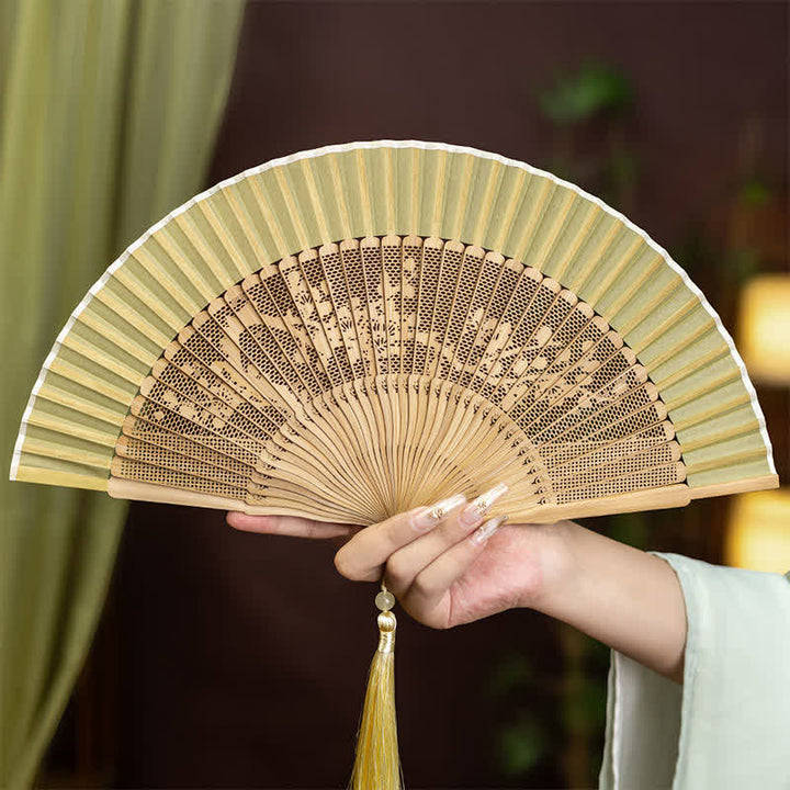 Buddha Stones Bamboo Hollow-Carved Famous Spots Landscapes Animals Tassel Folding Fan - Plum Blossom(Complimentary Tassel) - image 4