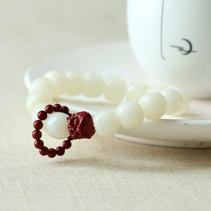 Buddha Stones Natural Bodhi Seed Cinnabar Dancing Lion Charm Wisdom Harmony Wrist Mala